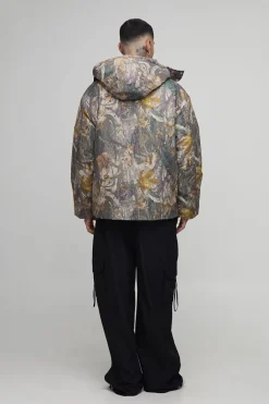Veste matelassée longue, surdimensionnée, à capuche avec col entonnoir en camouflage forêt