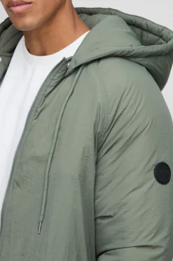 Veste parka matelassée à capuche et col entonnoir, coupe régulière et longue