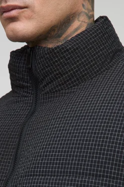 Veste puffer surdimensionnée à carreaux ripstop avec col entonnoir