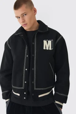 Veste Varsity en melton noire à coupe boxy avec détails de surpiqûres